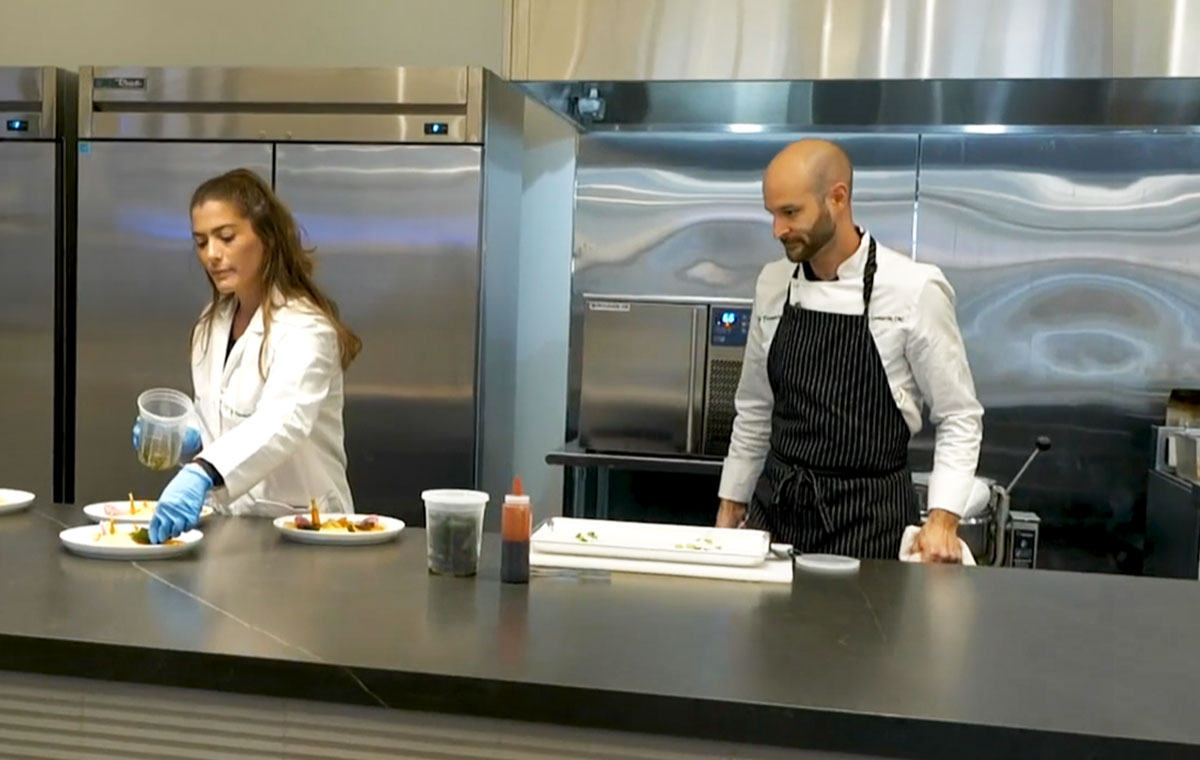 chef and assistant plating food