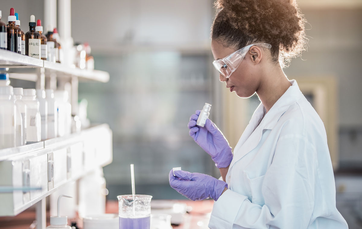 lab person smelling a fragrance